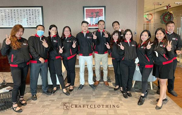 The China-Philippines United Enterprise team happily rocking their custom made jackets by Craft Clothing.